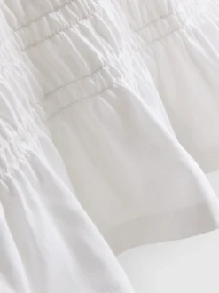 7–15 Jahre | Gesmoktes T-Shirt mit Schößchen