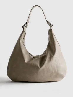 Lässige Schultertasche mit Zierringen