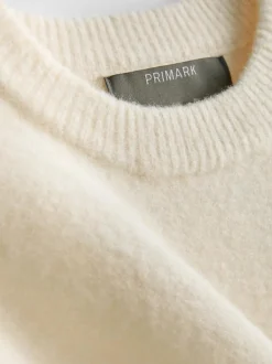 Pullover mit Brosche