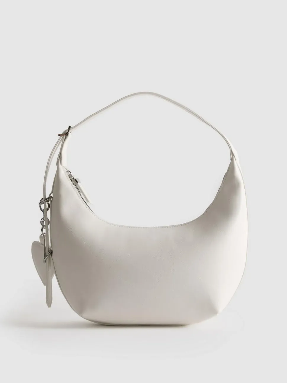 Schultertasche mit Herzanhänger