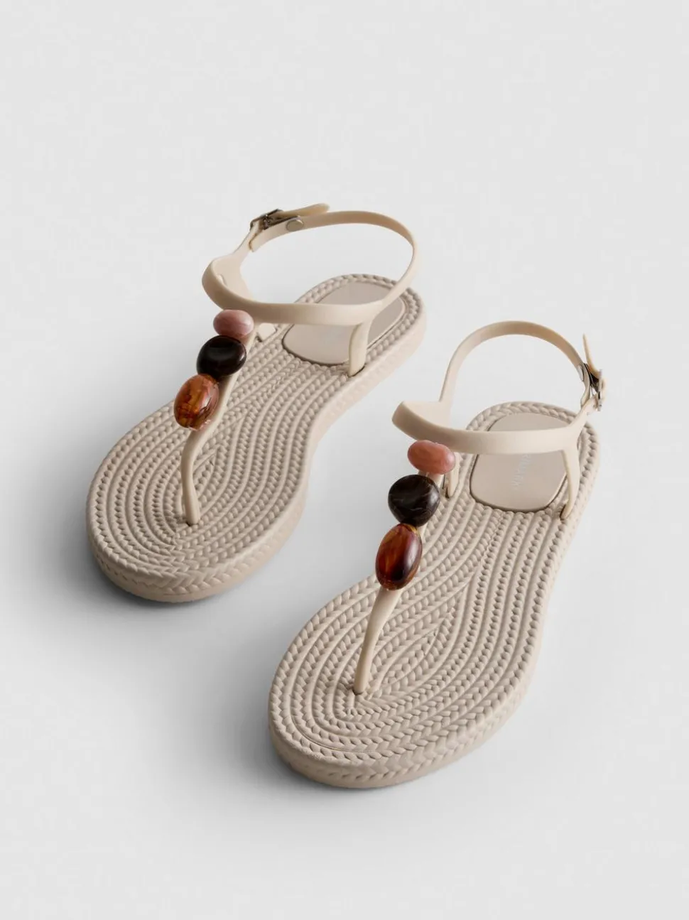 Zehenstegsandalen mit Perlen